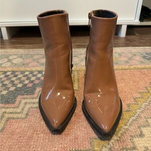 Tan and brown ankle boots with a 3.5 inch heel.
